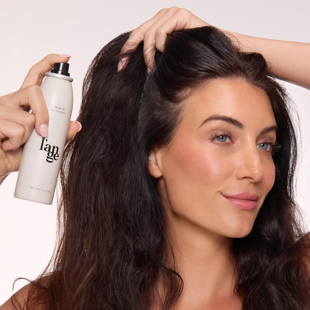 L'ANGE HAIR applied during morning routine for instant volume boost
