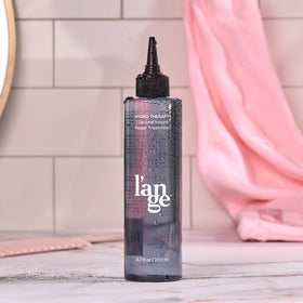 L'ANGE HAIR lifestyle on bathroom vanity showing everyday styling convenience