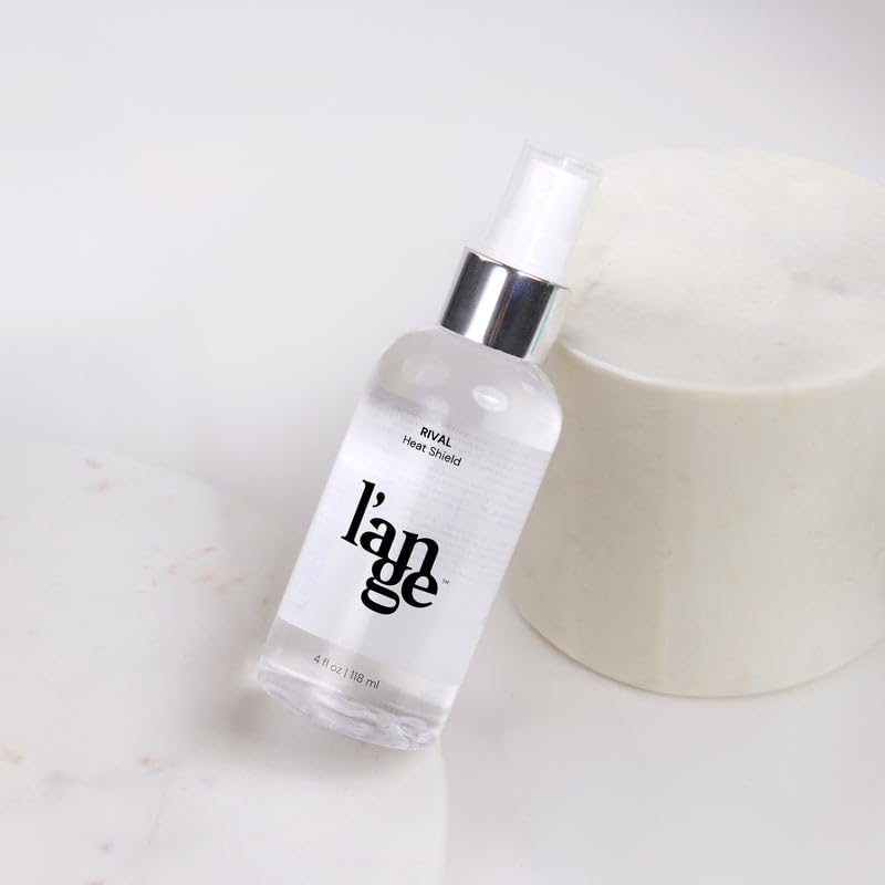 Jojoba and safflower oils near L'ANGE HAIR bottle highlighting nourishing ingredients