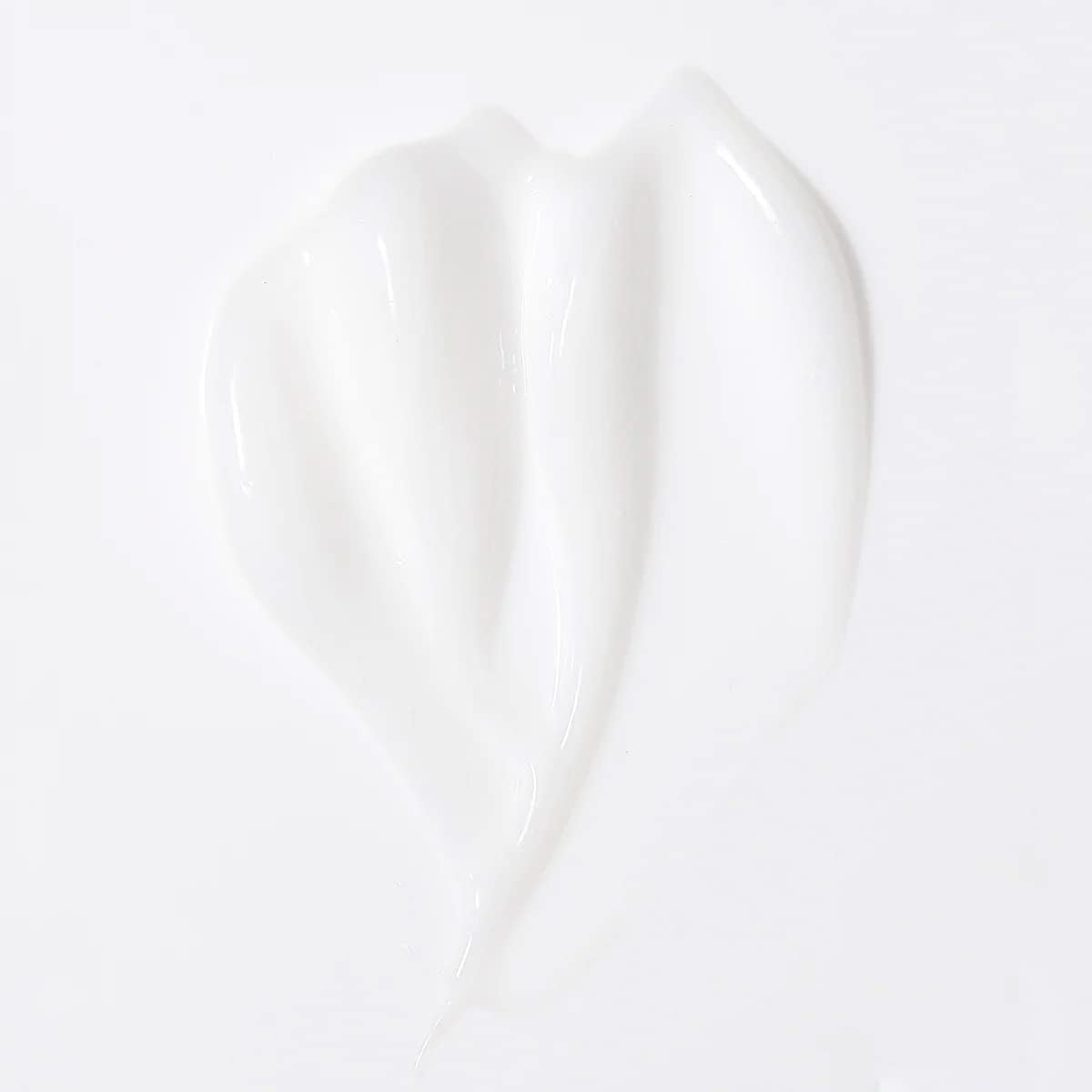 L'ANGE HAIR bottle held for scale showing travel-friendly curl care benefit