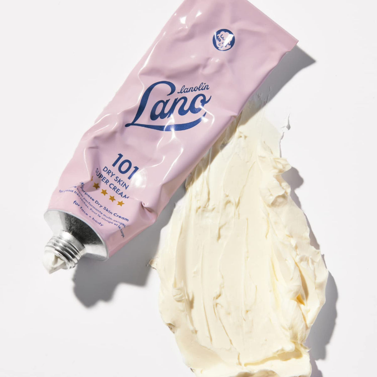 Lanolips ingredients display highlighting triple lanolin and nourishing oils