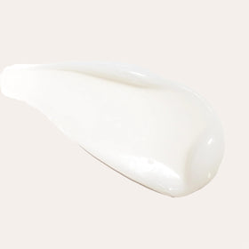 L’ANZA bottle styled on bathroom shelf conveying professional care and daily routine benefit