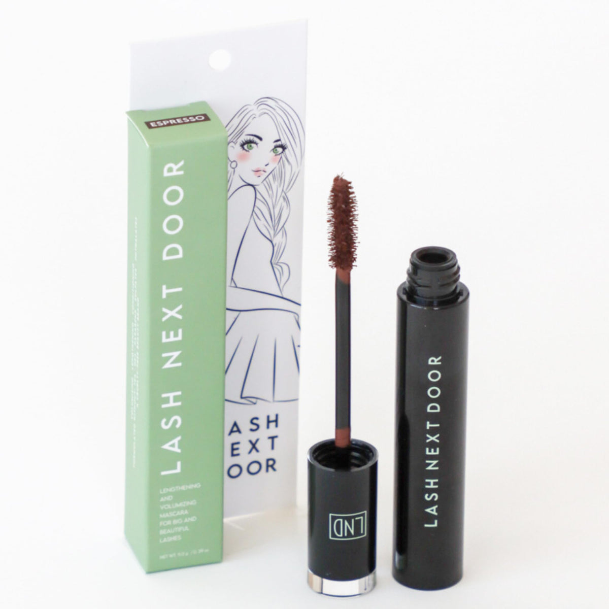Lash Next Door on model in everyday setting showing subtle, natural-looking lashes