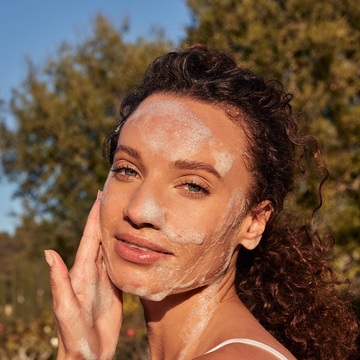 LATHER close-up of cleanser texture, showing creamy foam and hydrating finish