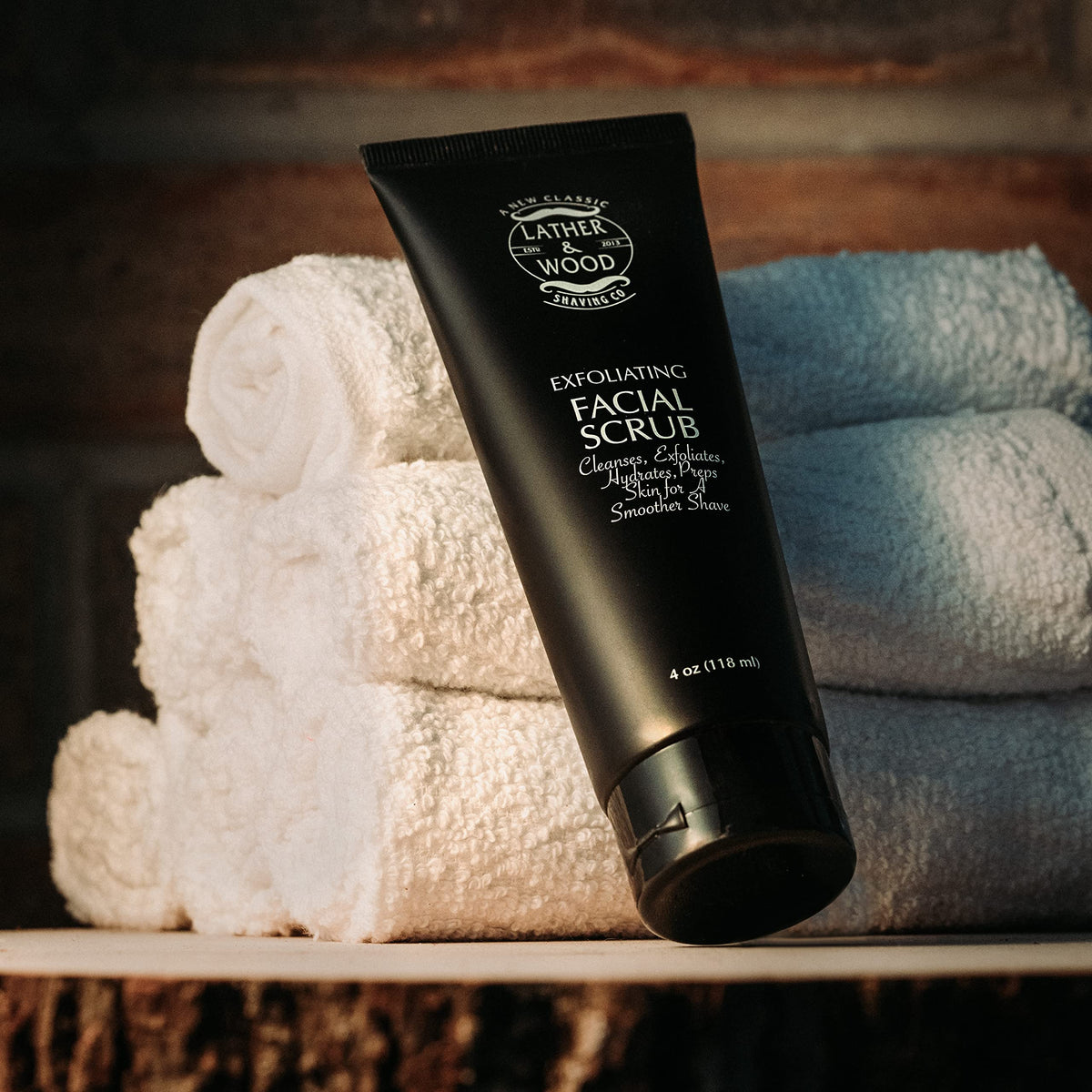 Lather & Wood 4oz bottle beside a razor showing compact travel-friendly size