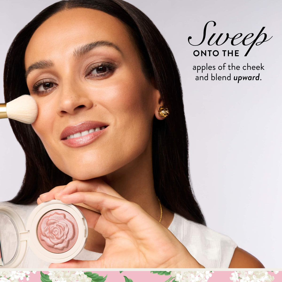 LAURA GELLER compact held in hand to show true size and portability
