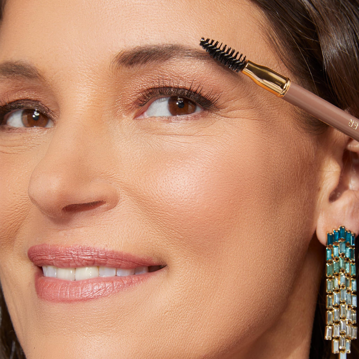 LAURA GELLER NEW YORK texture swatches on arm, shows taupe shade payoff