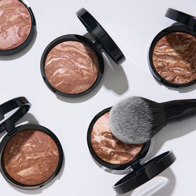 LAURA GELLER NEW YORK bronzer swept on collarbone for sun-kissed body warmth