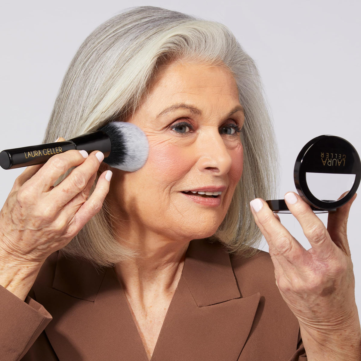 LAURA GELLER NEW YORK compact opened with brush showing ready-to-use set