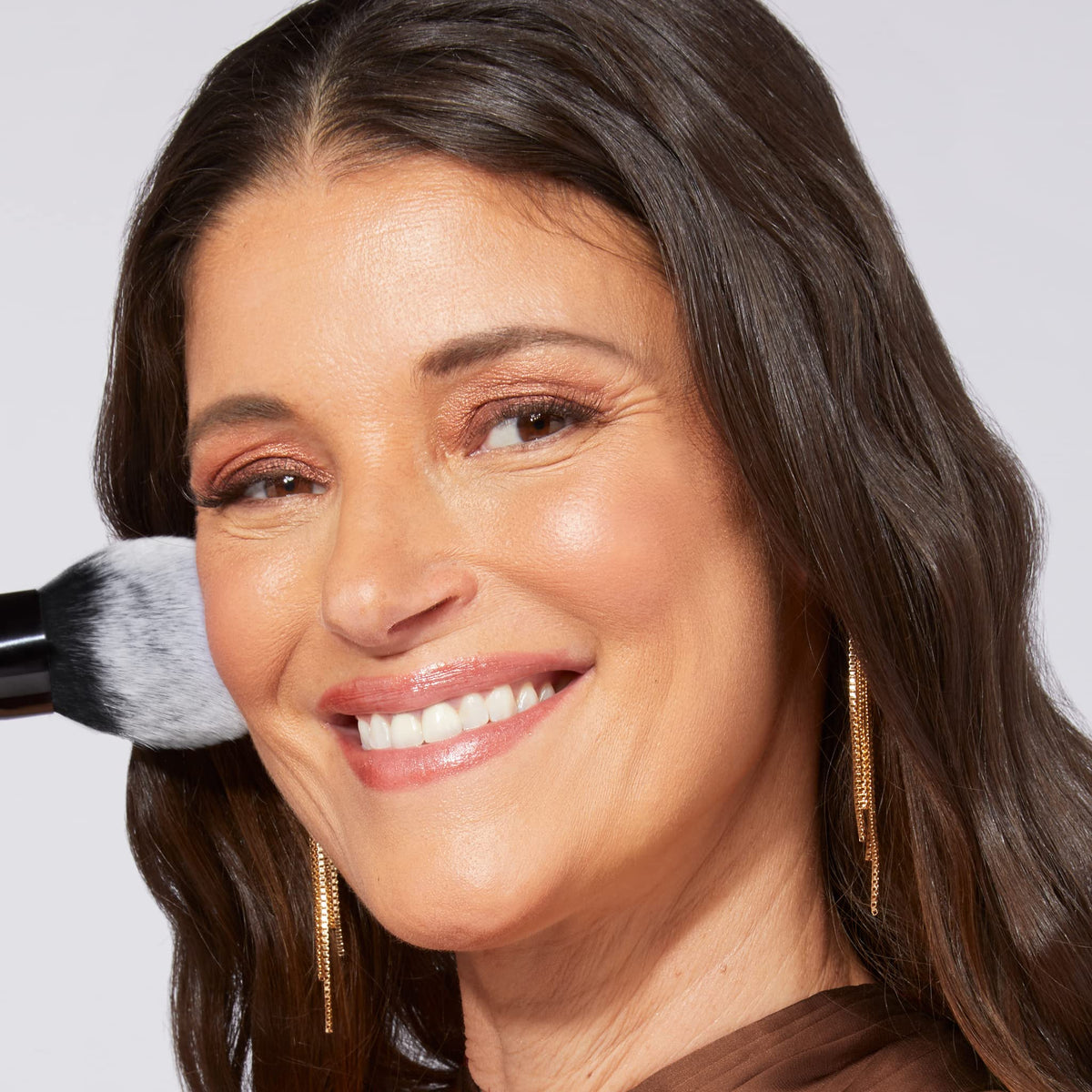 LAURA GELLER NEW YORK product label close-up emphasizing ingredients and shade