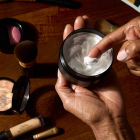 LAURA GELLER NEW YORK flatlay of natural ingredients emphasizing soothing, hydrating formula