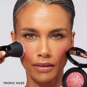 LAURA GELLER NEW YORK open kit displaying foundation, blush, and brush for coordinated look
