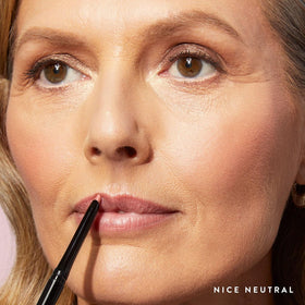 LAURA GELLER NEW YORK lip closeup with liner applied showing clean edge and long‑wear benefit