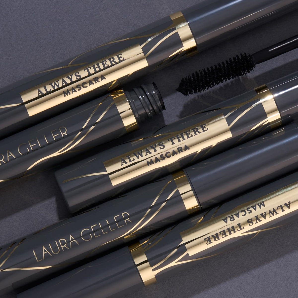 LAURA GELLER NEW YORK mascara applied on closed eye highlighting defined curled lashes