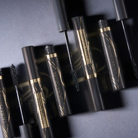 LAURA GELLER NEW YORK open mascara tube revealing formula and inner brush detail