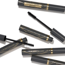 LAURA GELLER NEW YORK tube in hand illustrating compact travel-friendly size