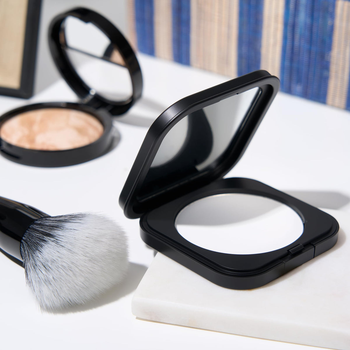 Laura Geller on-model T-zone demonstrating oil control and matte results