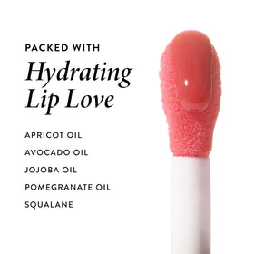 LAURA GELLER NEW YORK size comparison in hand showing portable, on-the-go moisturizing gloss