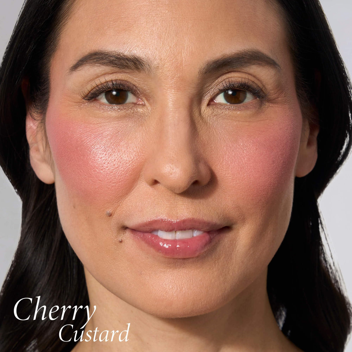 LAURA GELLER NEW YORK brush swipe demonstrating buildable, streak-free application