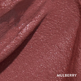 LAURA GELLER NEW YORK Mulberry swatch on skin showing rich pigment and smooth finish benefit