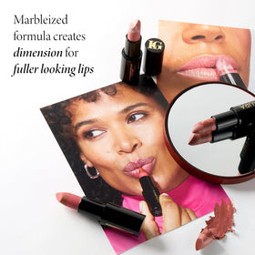 LAURA GELLER NEW YORK lipstick applied on lips demonstrating mauve-brown color and hydration