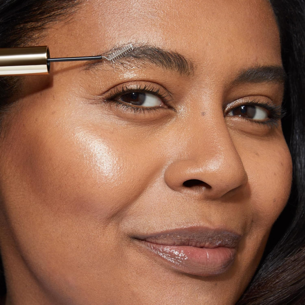 LAURA GELLER NEW YORK product held in hand to show compact travel-friendly size