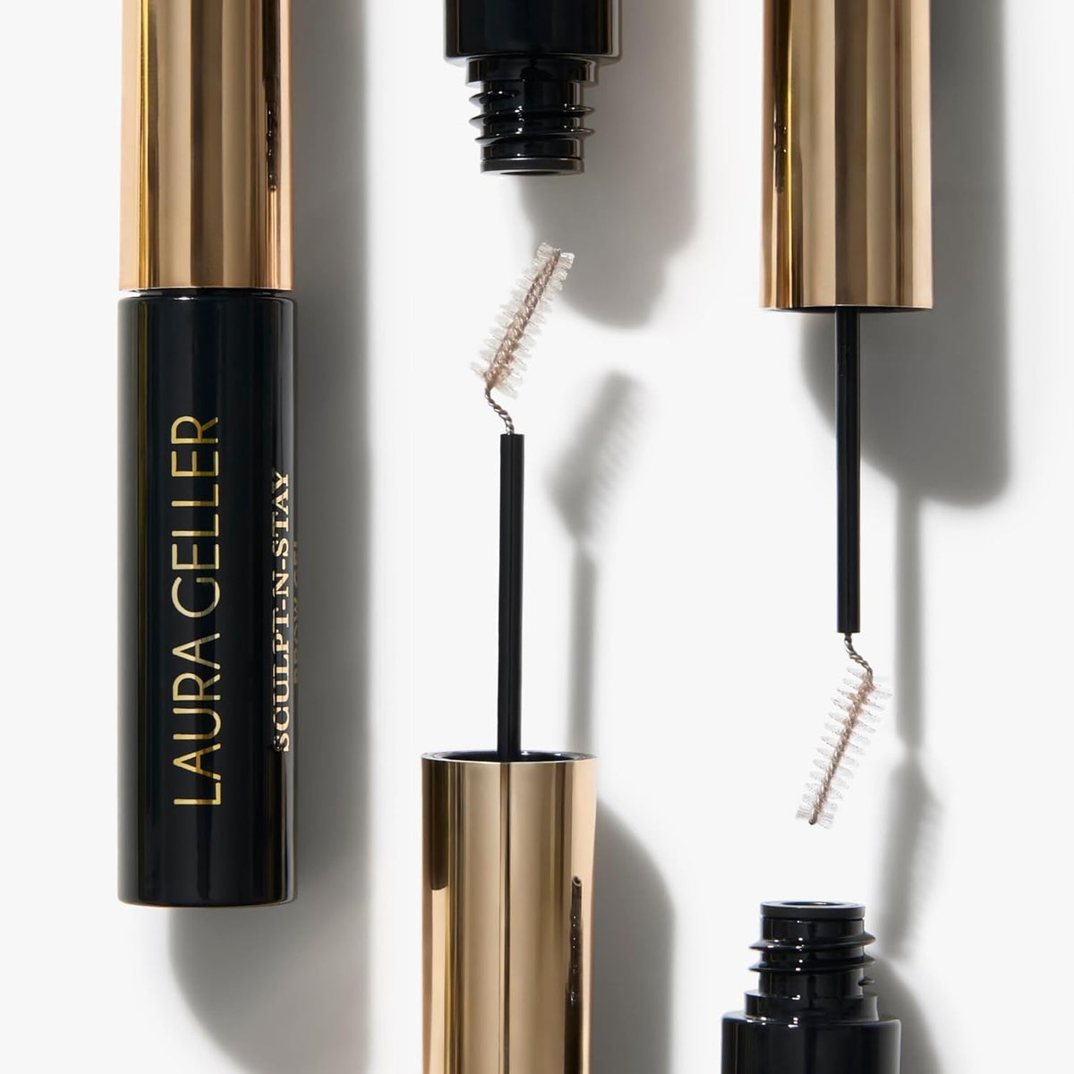 LAURA GELLER NEW YORK brow pencil placed on bathroom counter for daily routine