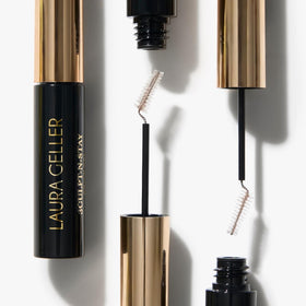 LAURA GELLER NEW YORK brow pencil placed on bathroom counter for daily routine