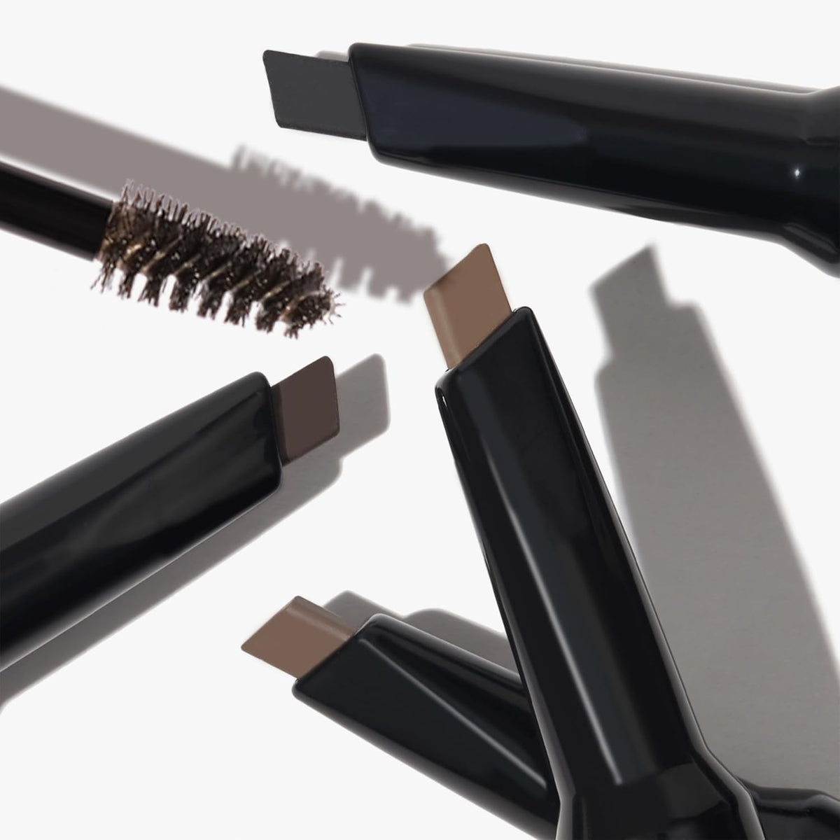 LAURA GELLER product placed with spoolie and brush for grooming routine