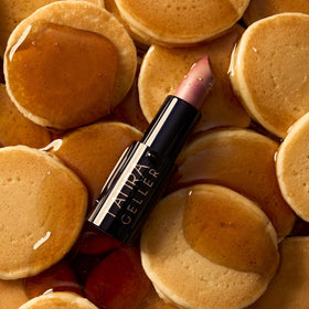 LAURA GELLER side angle of lipstick bullet showing cream formula and precise tip