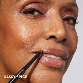 LAURA GELLER NEW YORK lip liner held in hand to show size and portability