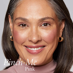 LAURA GELLER NEW YORK finger blending blush on cheek demonstrating seamless finish