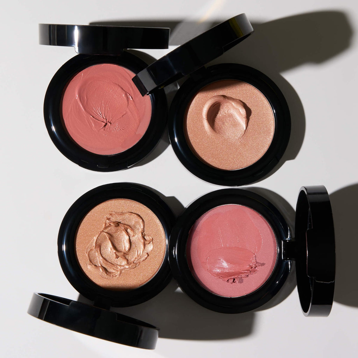 LAURA GELLER NEW YORK Balm tucked into travel pouch for easy on-the-go touchups