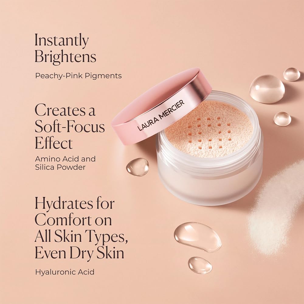 Laura Mercier powder being applied with a fluffy brush for soft-focus coverage