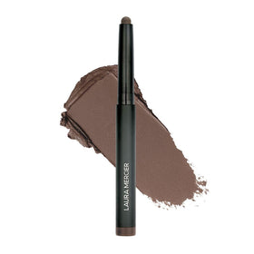 Laura Mercier front packaging of Café Noir stick showing sleek tube and label benefit long wear