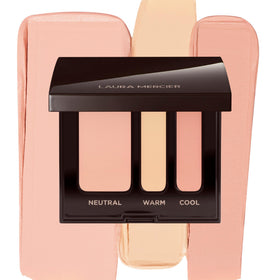 Laura Mercier compact front open showing dual-concealer pans and mixing area for perfect match