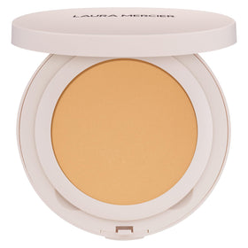 Laura Mercier compact front view showing sleek packaging and portability benefit