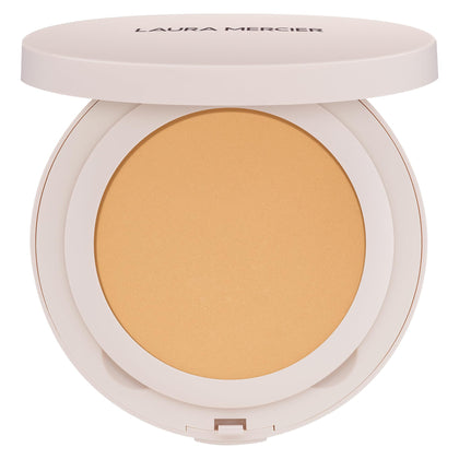 Laura Mercier compact front view showing sleek packaging and portability benefit