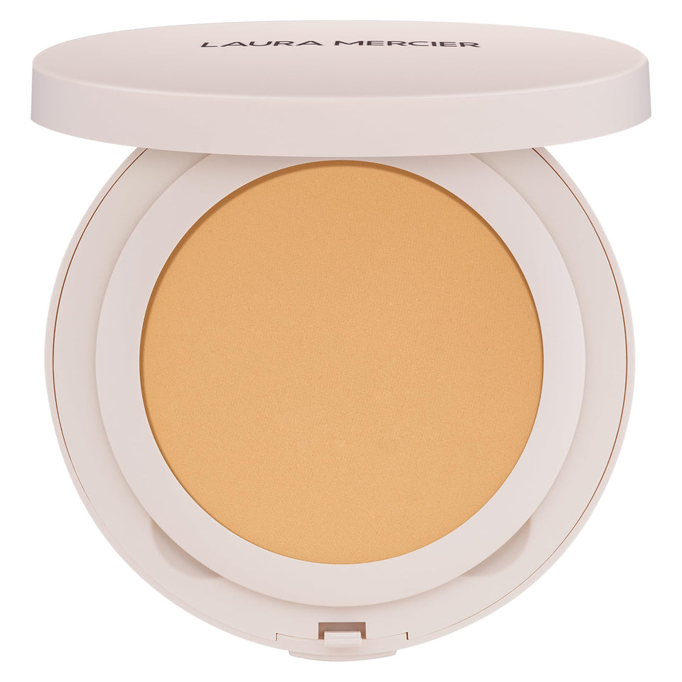 Laura Mercier compact front view showing sleek packaging and portability benefit