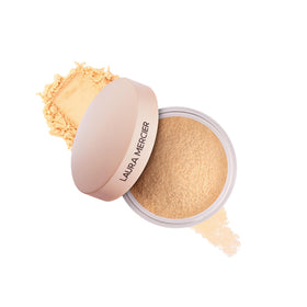 Laura Mercier mini jar front view showing sleek packaging and portability benefit