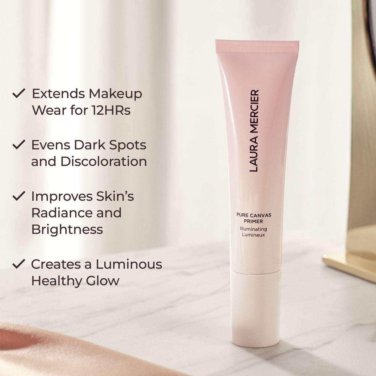 Laura Mercier primer near rose petals highlighting moisturizing extracts