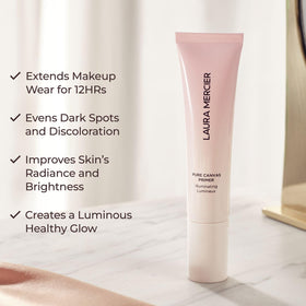 Laura Mercier primer near rose petals highlighting moisturizing extracts