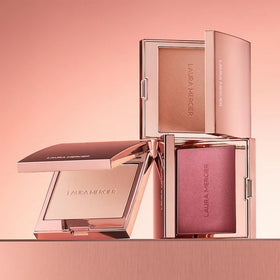 Laura Mercier cheek detail on model showing glowing finish and realistic radiance