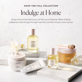 Laura Mercier jar beside hand showing product size and travel-friendly benefit