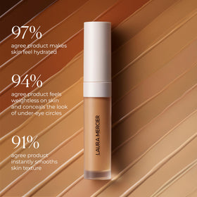 Laura Mercier size comparison in hand illustrating travel-friendly convenience benefit