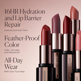 Laura Mercier lipstick next to coin for scale showing compact size and travel-friendly design