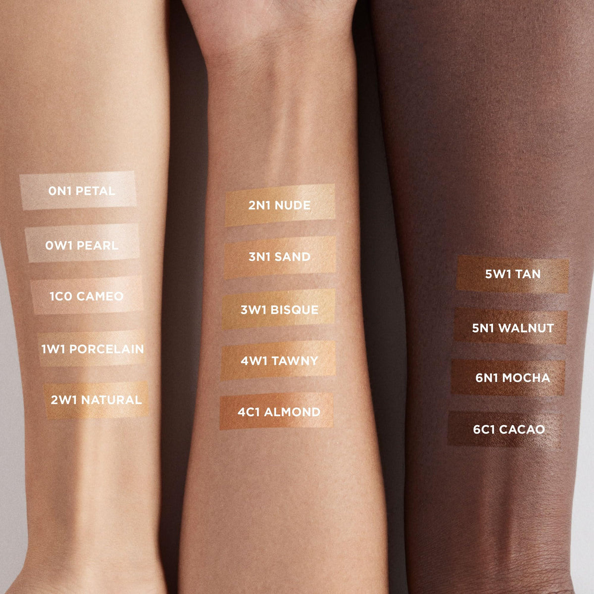 Laura Mercier swatch on wrist in Sand showing sheer, buildable coverage