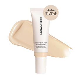 Laura Mercier texture close-up displaying silky dewy cream for visible hydration