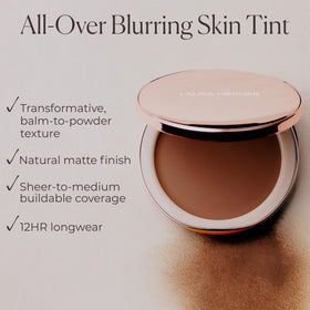 Laura Mercier application with fingers pressing balm for natural skin-like finish