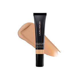 Laura Mercier front mini tube shown upright, travel-ready benefit